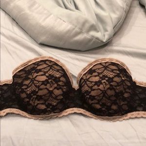 Beige and black strapless bra